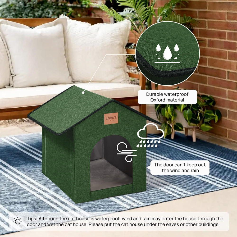 Love's cabin weatherproof cat shelter in green outdoors ready for rain.