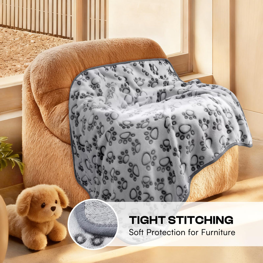 Luciphia paw-print blanket on cat bed showcases versatility for pets