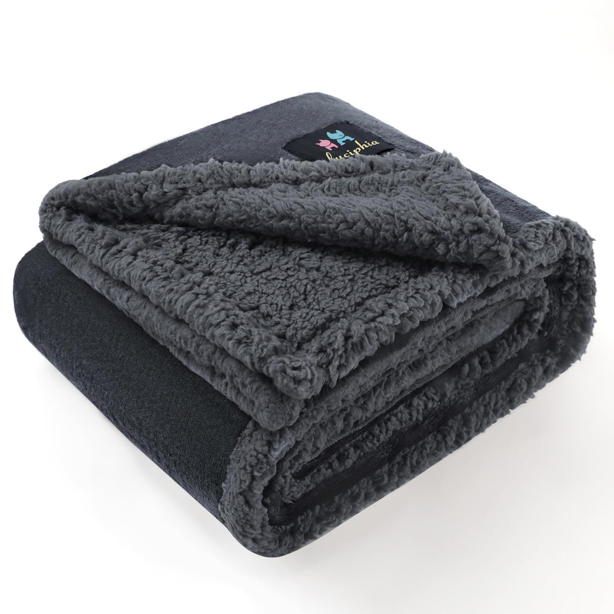 Luciphia waterproof bed blanket folded in grey protects furniture from spills.