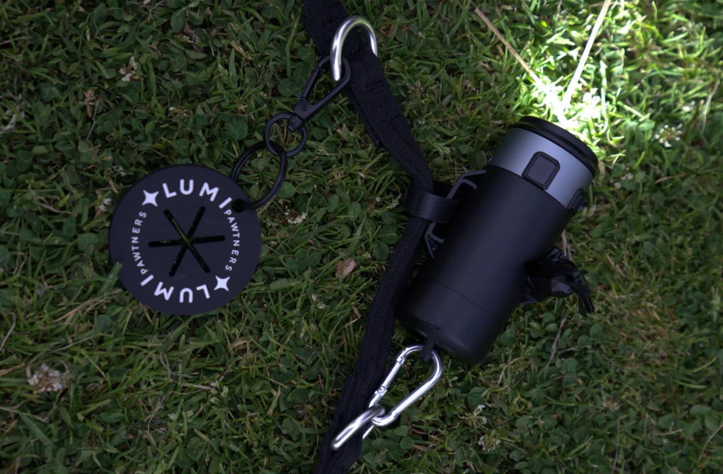 Lumi Pawtners weather-resistant black design suits camping and late-evening walks.