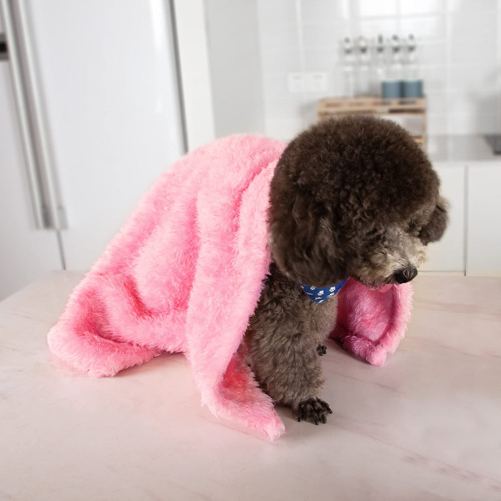 MACEVIA fluffy fleece dog blanket pink color draped for nighttime cuddles.