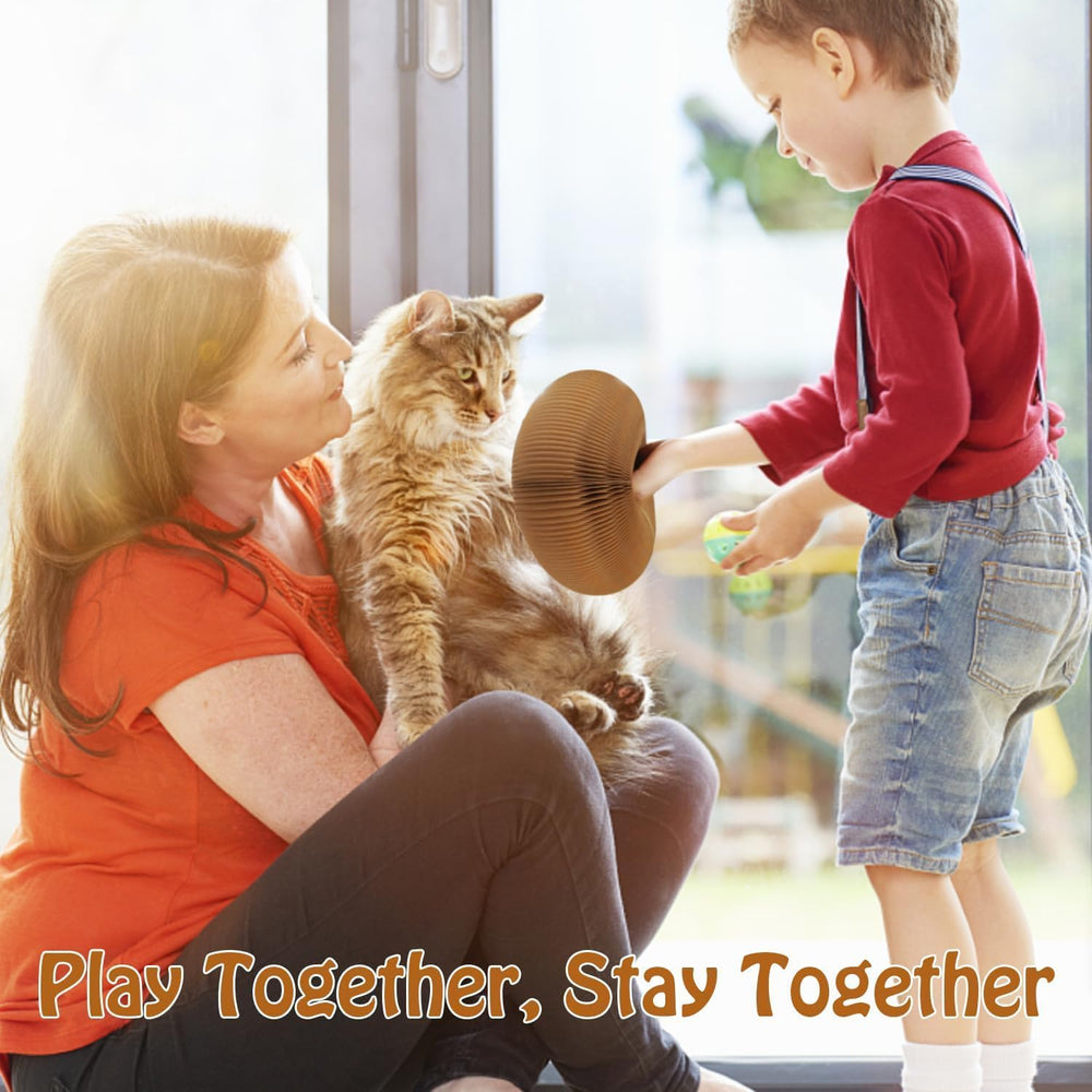 Magic Organ foldable cat scratchboard with bell ball illustrates interactive play during supervision.