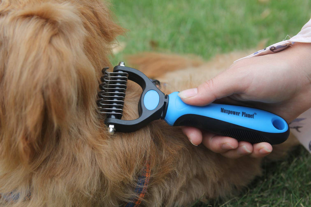 Maxpower Planet grooming brush with non-slip handle for comfortable, controlled brushing sessions.