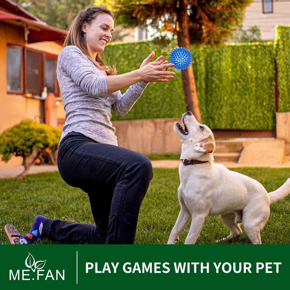 ME.FAN high-resiliency ball bouncing on grass for fetch and exercise.