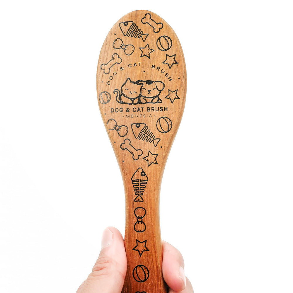 Menesia Pet Soft Brush used on a small dog for gentle coat care and massage.