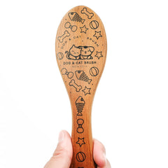 Menesia Pet Soft Brush used on a small dog for gentle coat care and massage.