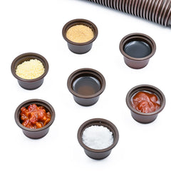 MRTIOO eco cups on a reptile feeding ledge for crested gecko meals