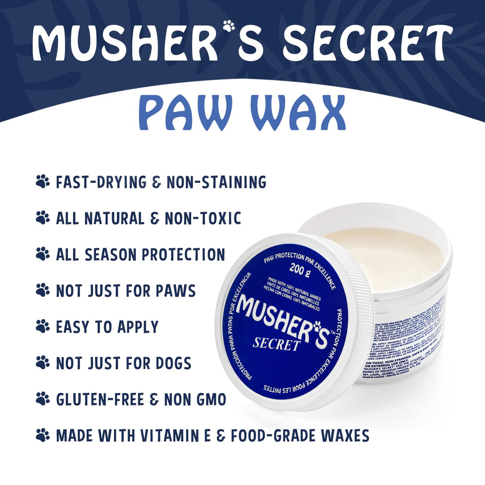 Musher's Secret dog owner applying paw wax during walk.