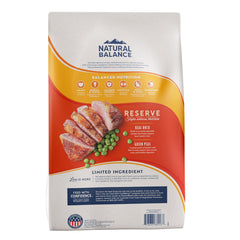 Natural Balance duck-first-ingredient kibble closeup shows protein-rich bites for lean muscles.