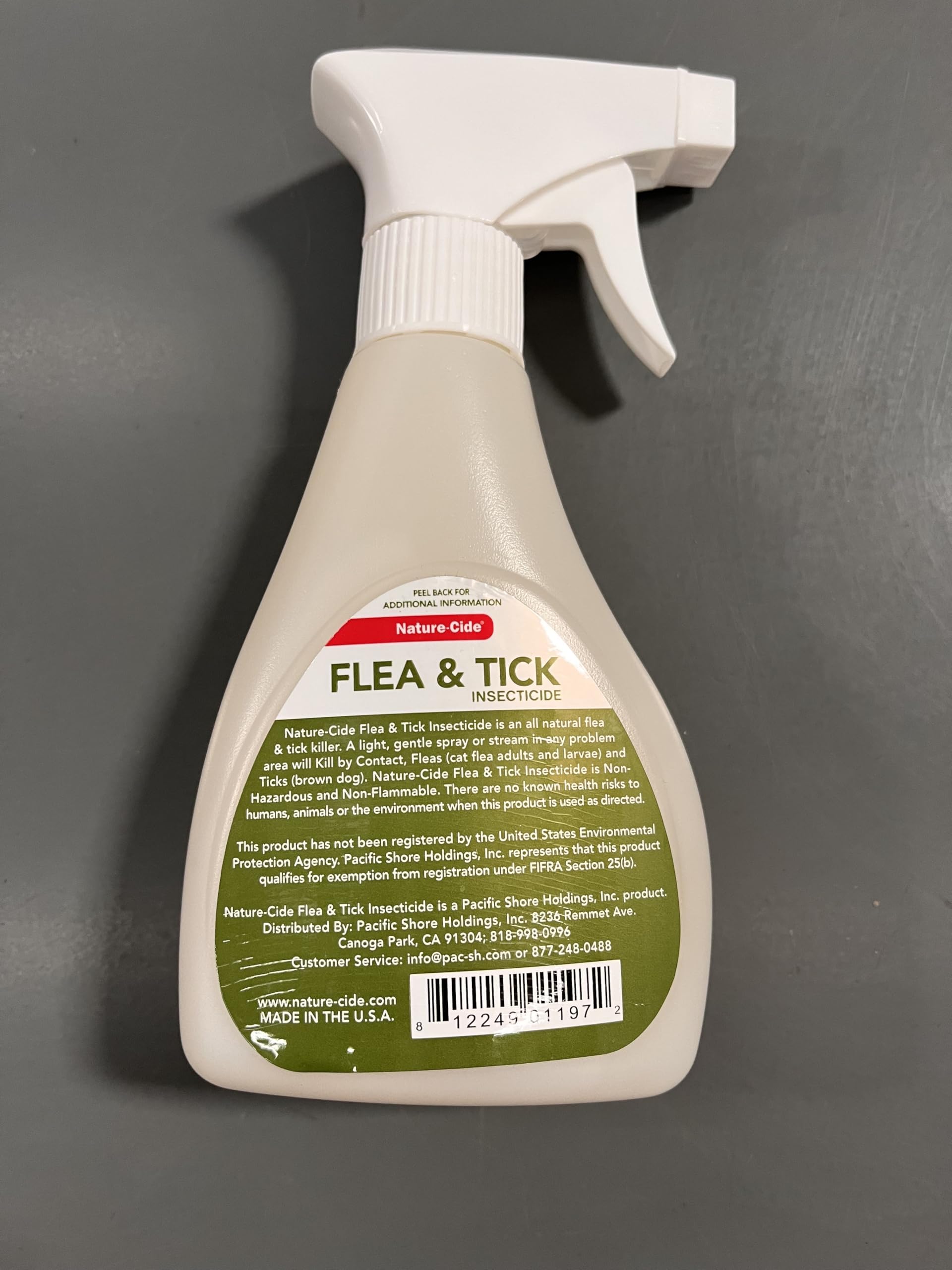 Nature-Cide Flea & Tick outdoor patio application near garden.