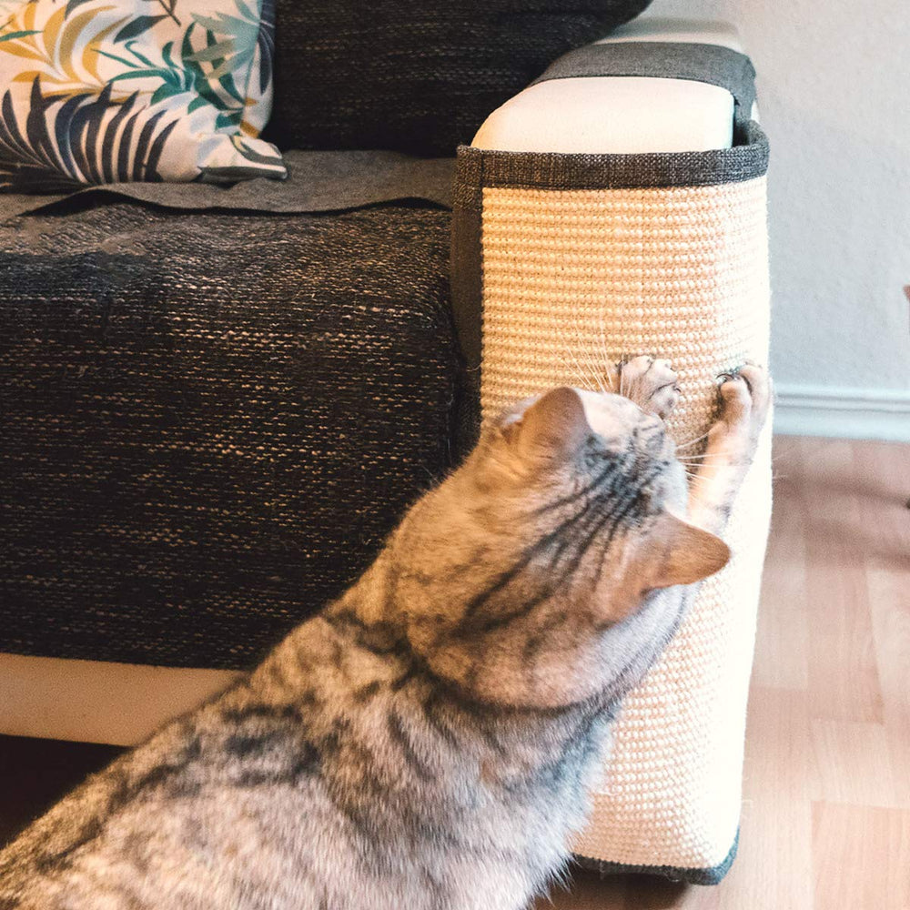 Navaris Cat Scratch Mat hook and loop fastener secures mat to sofa for stable placement.