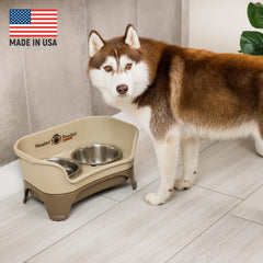 Neater Feeder Express cappuccino side profile demonstrates elevated stand supporting comfortable feeding posture.