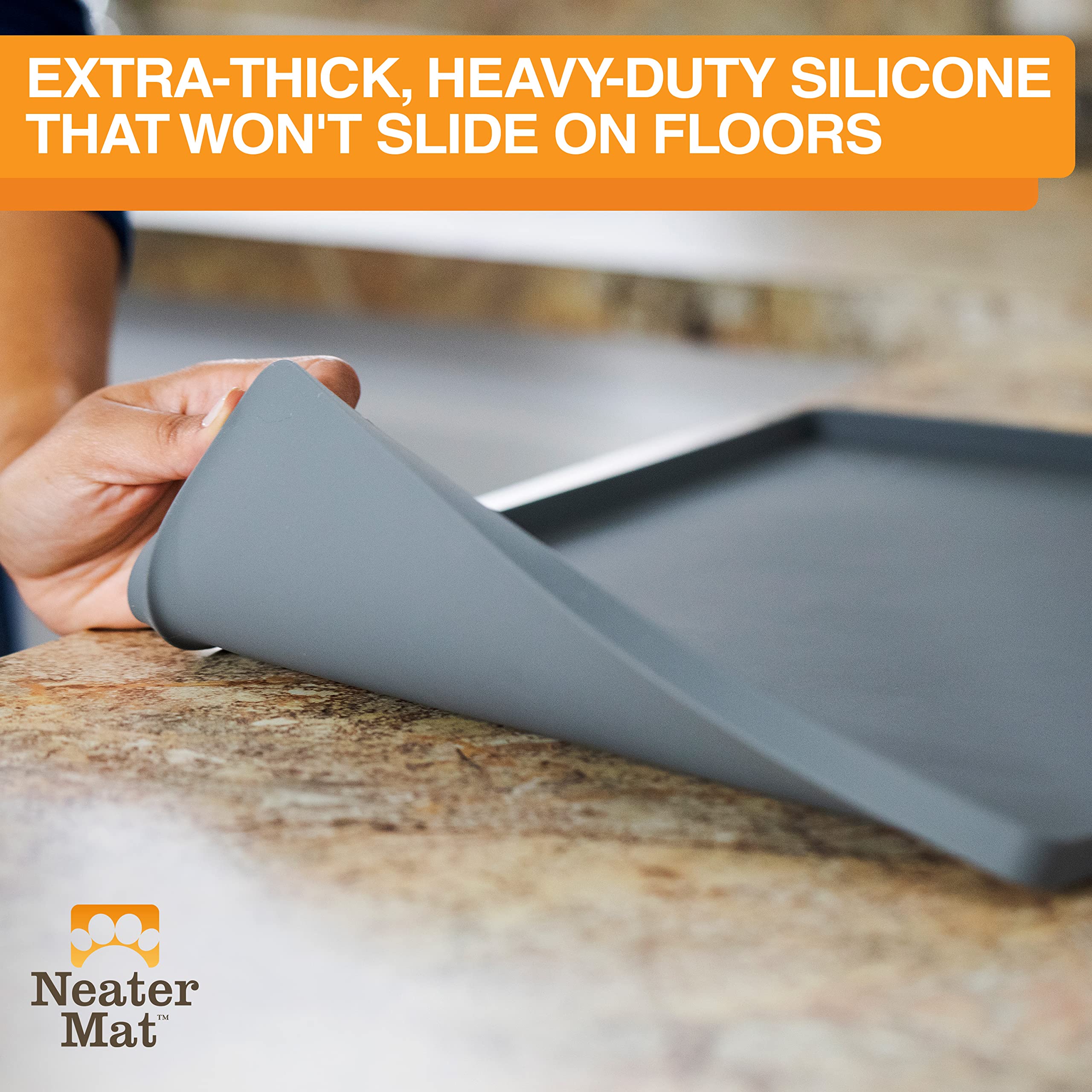 Neater Mat silicone surface is easy to wipe clean after meals.