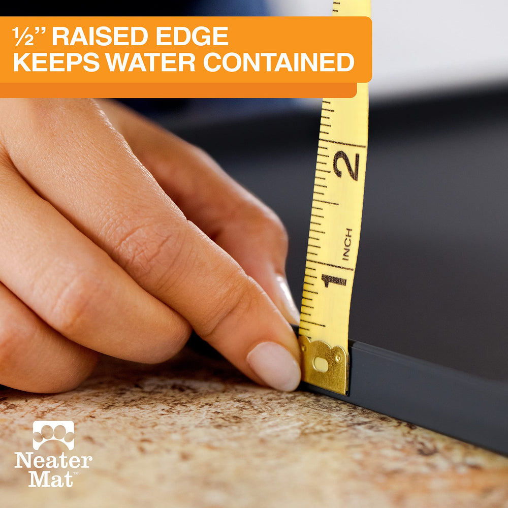 Neater Mat raised edge helps prevent run-off during meals.