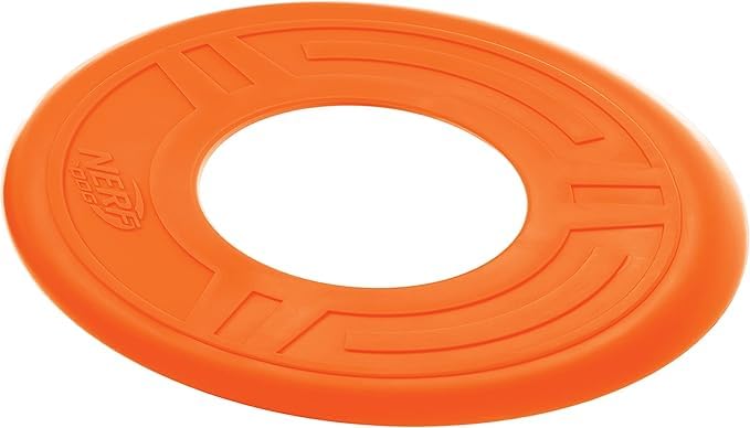 Nerf Dog Atomic Flyer orange disc floating on water for lake or pool play.