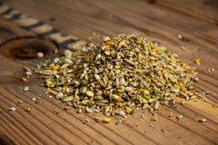 New Country Organics olive oil layer feed bag-back highlights corn-free and soy-free nutrition for sensitive flocks.