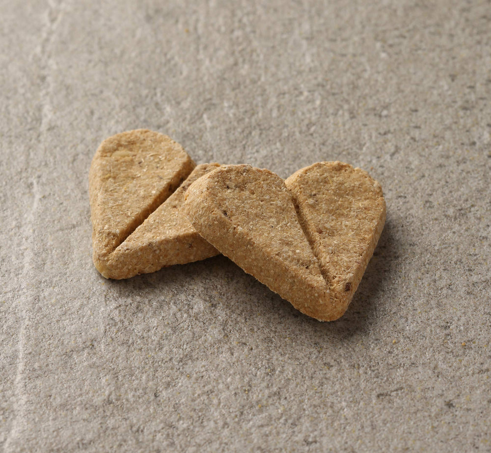 Newman's Own Dog Biscuits heart-shaped breakable treats for portion-controlled rewards.