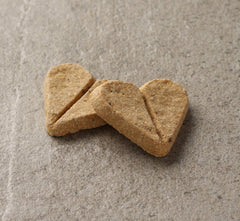 Newman's Own Dog Biscuits heart-shaped breakable treats for portion-controlled rewards.