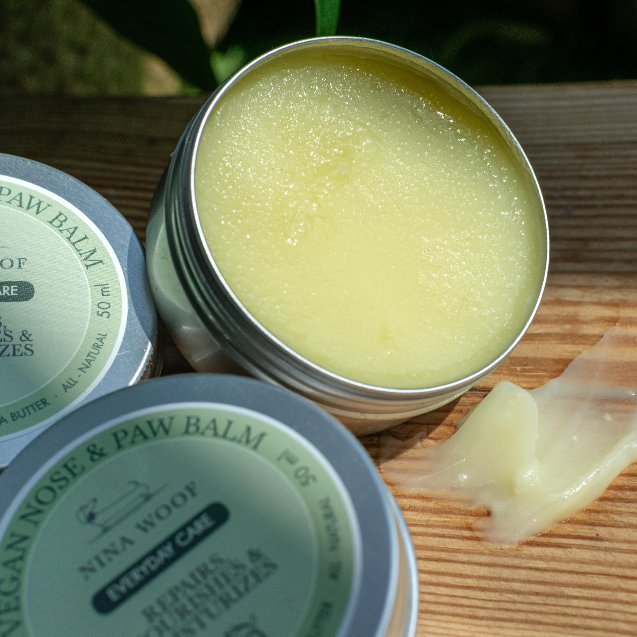 Nina Woof balm on a shelf promotes premium grooming ritual