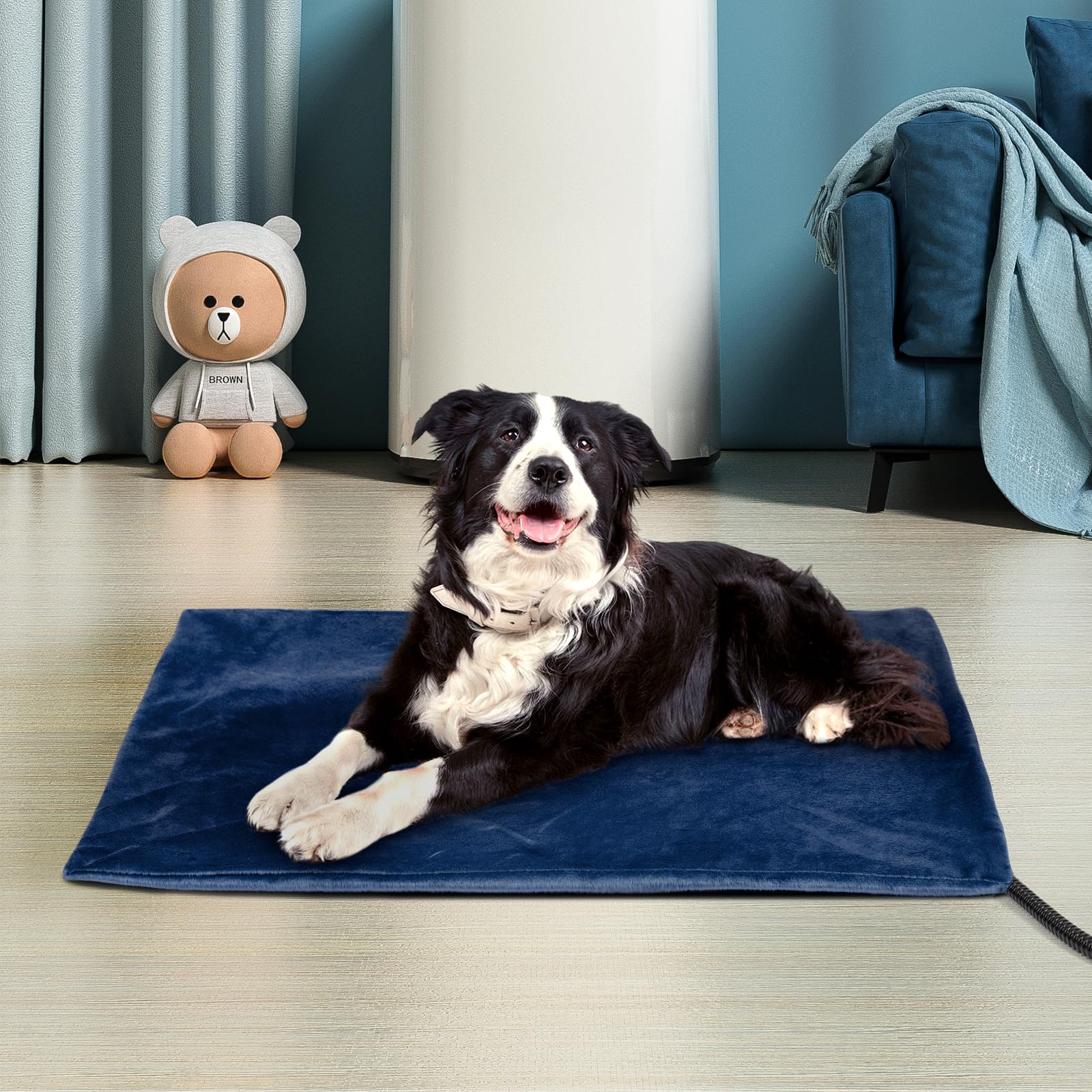 Niubya pet heating pad in use on couch with a relaxed dog.