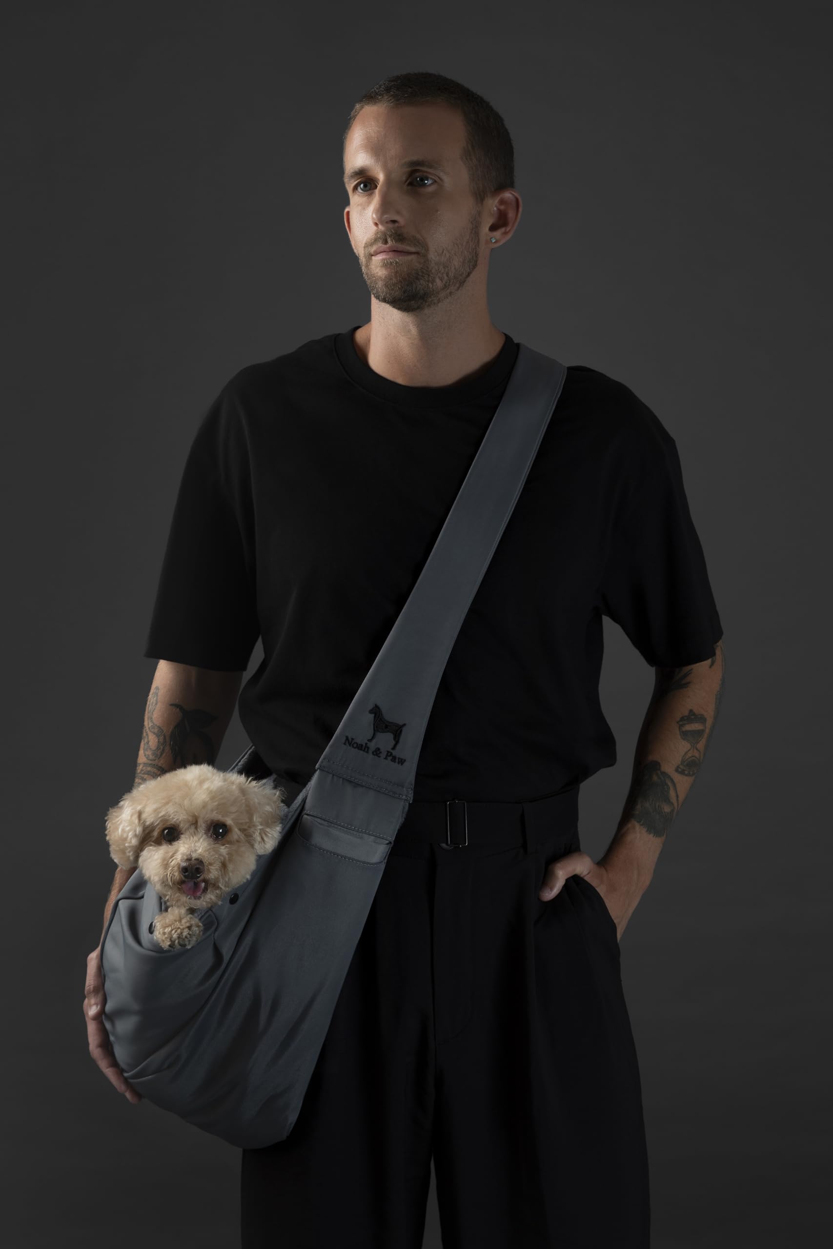 NOAH & PAW sling safety belt closure demonstrates two layer security during outings.