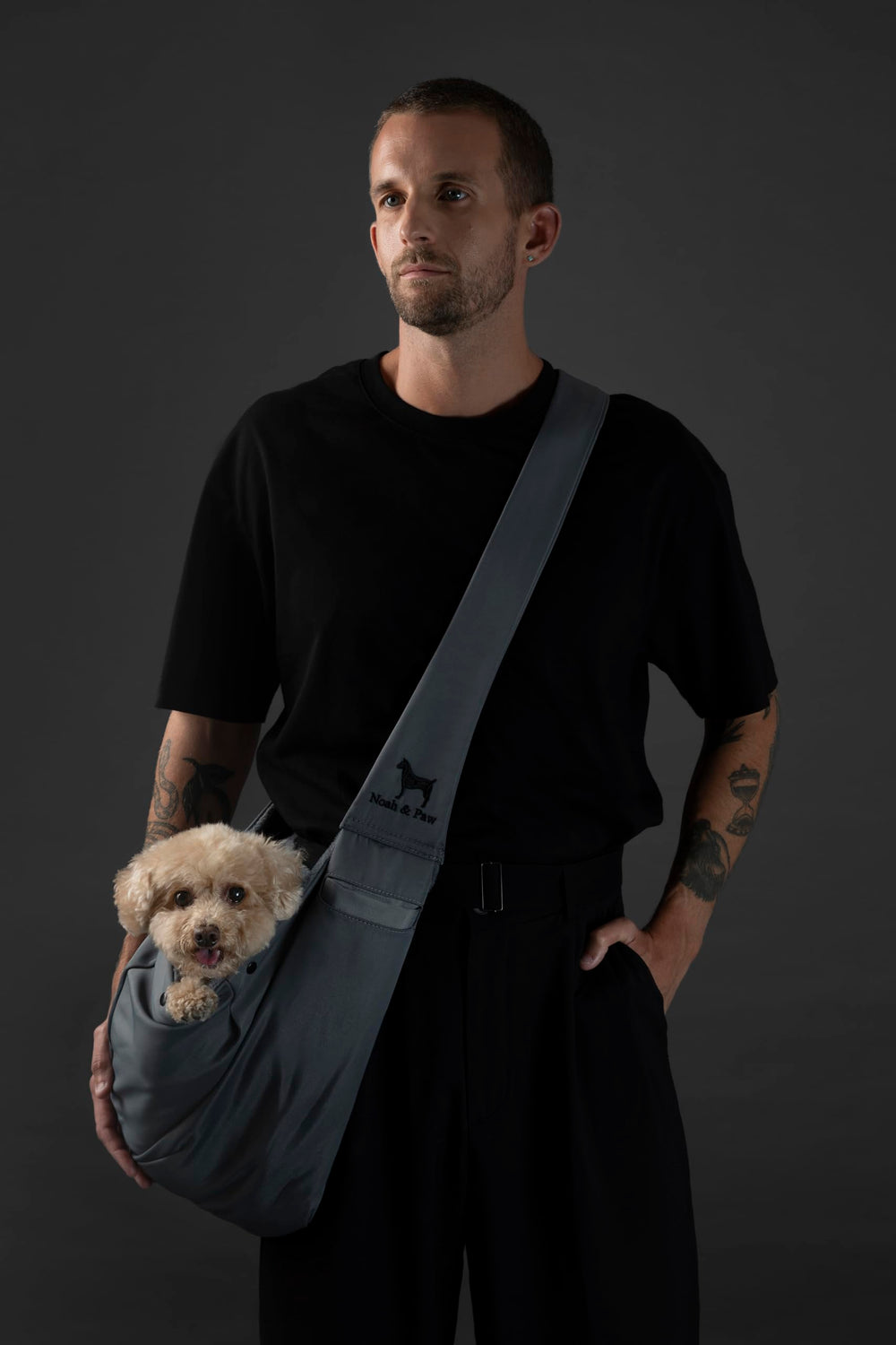 NOAH & PAW sling safety belt closure demonstrates two layer security during outings.