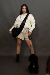 NOAH & PAW sling shows safety belt closure for secure use