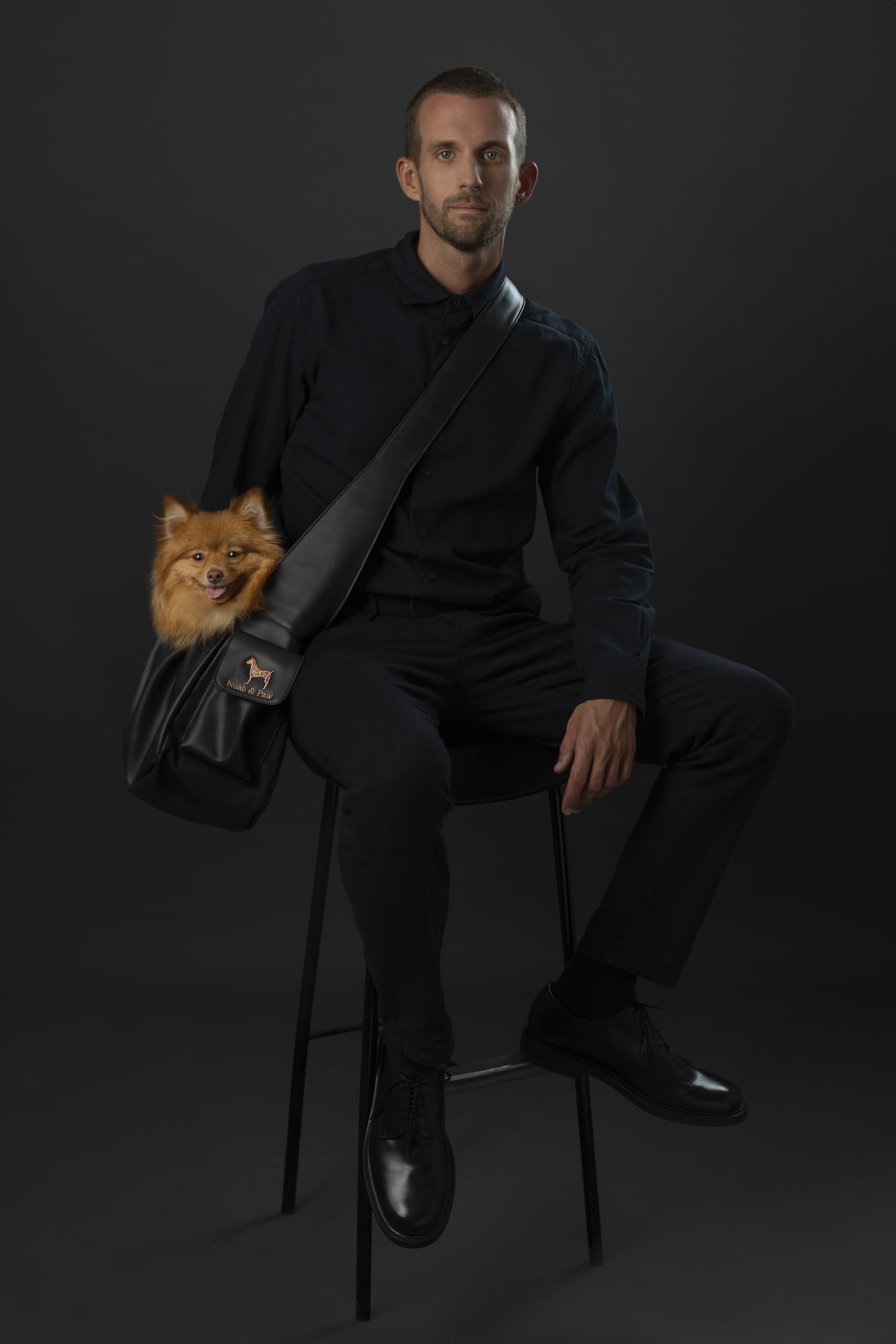 Noah & Paw dog sling side view highlighting adjustable strap for custom fit