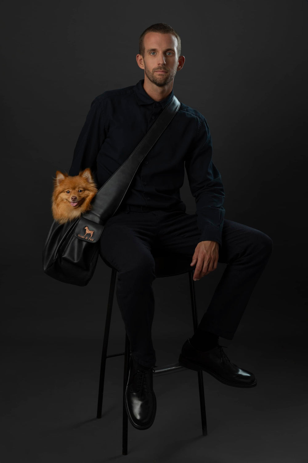 Noah & Paw dog sling side view highlighting adjustable strap for custom fit