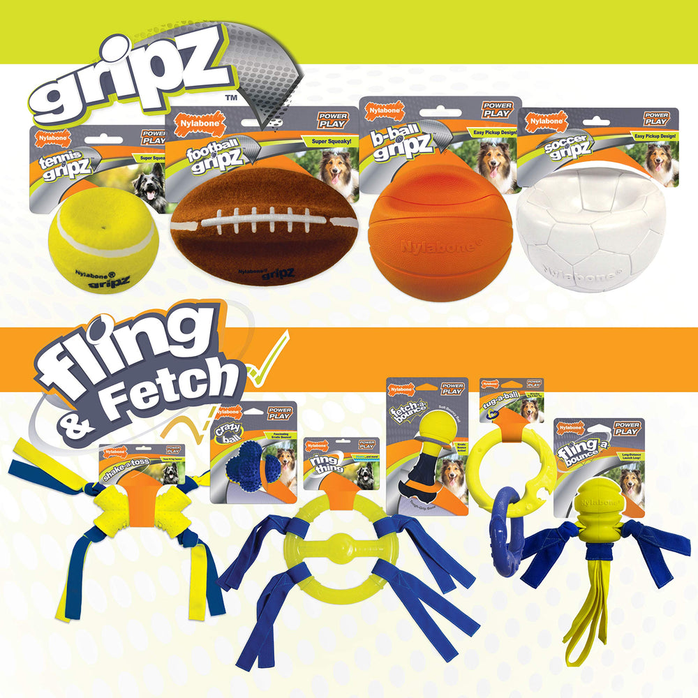 Nylabone Power Play Gripz Soccer Ball being chased outdoors by dog in yard
