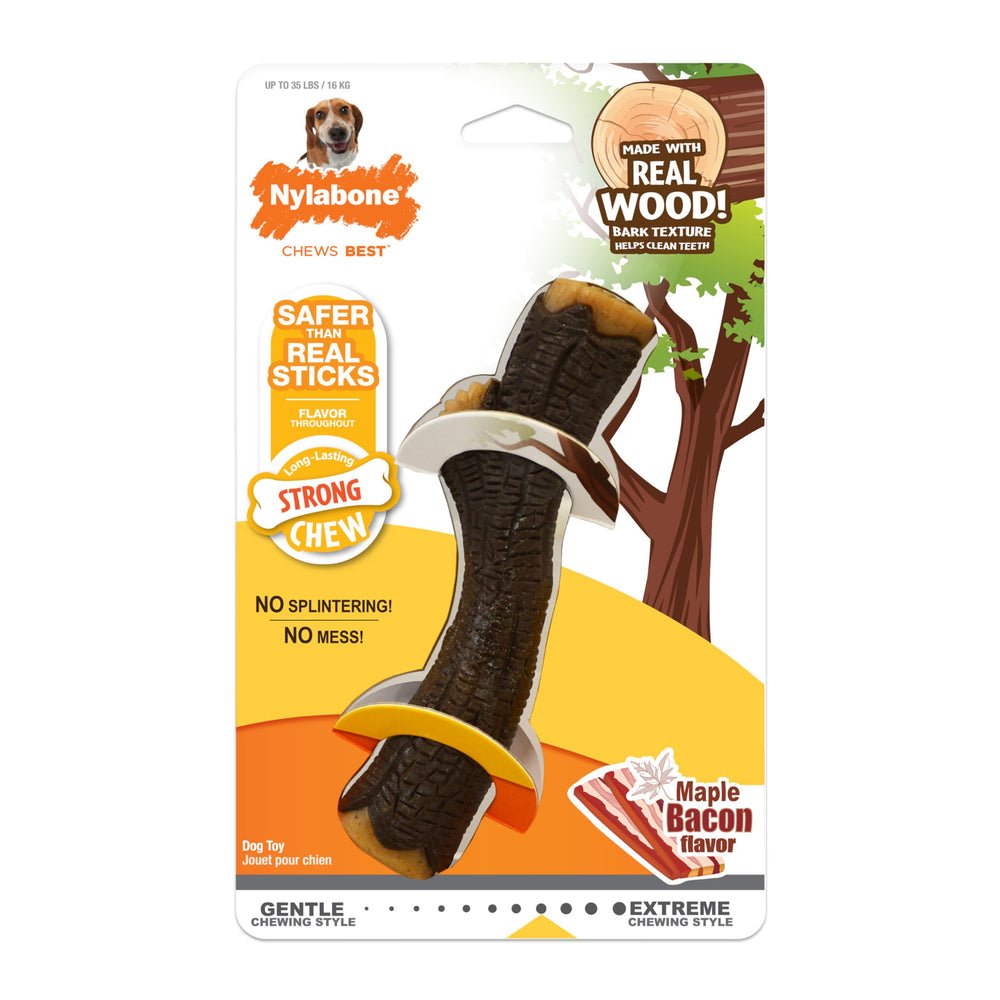 Nylabone Real Wood Stick Toy dog enjoying a chew session on hardwood floor