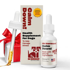 OH NORMAN! Calm Down bottle front shows the all-natural calming blend for dogs.