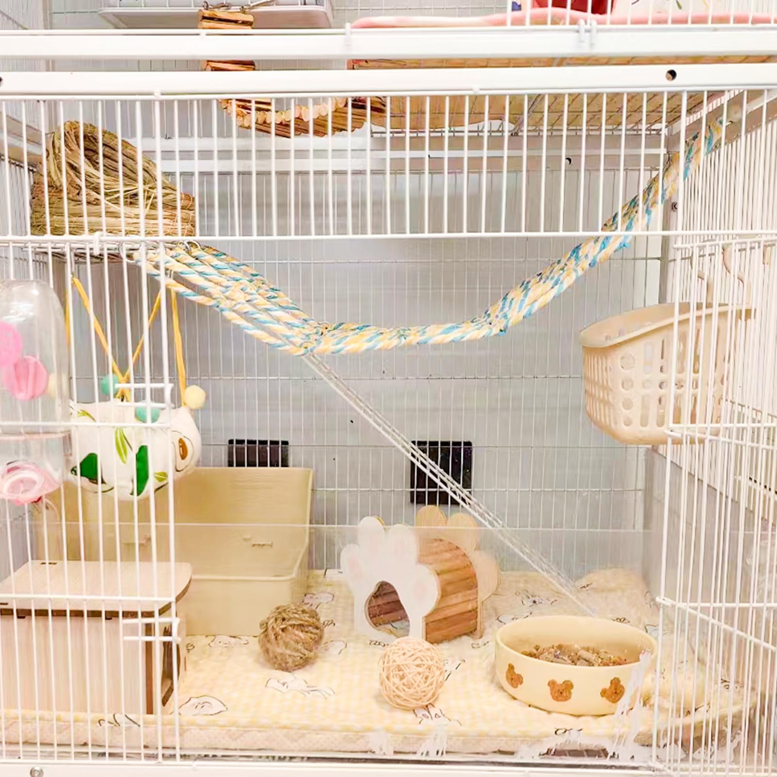 Oooct parrot climbing ladder bridge in a colorful cage setup for active climbing