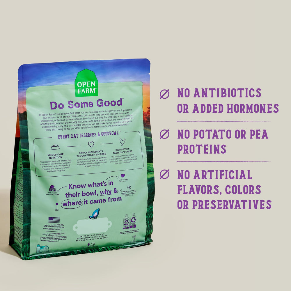 Open Farm Goodbowl chicken brown rice kibble on scoop for balanced nutrition.