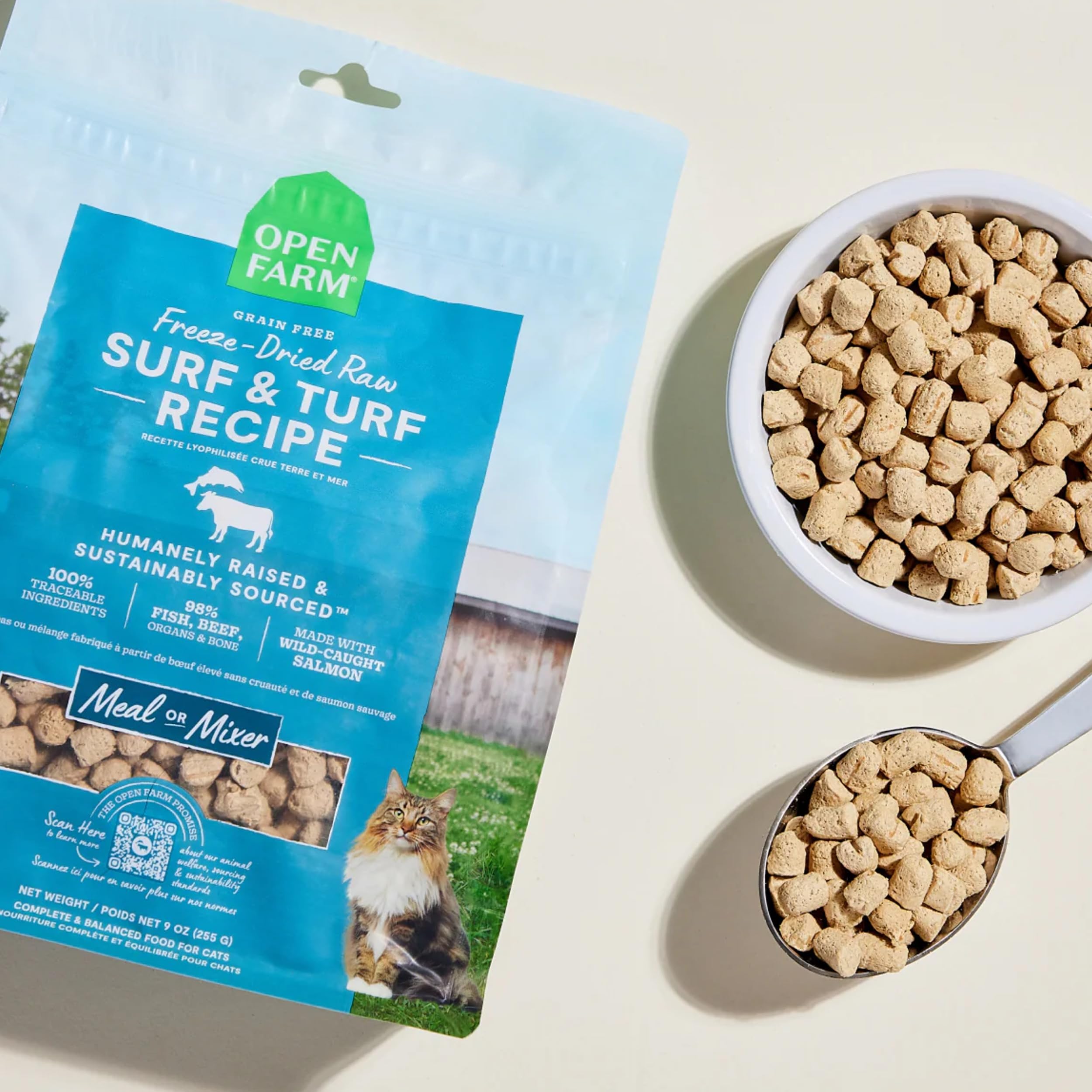 Cat eating Open Farm Surf & Turf freeze-dried raw food to show palatability