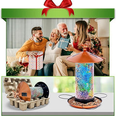 Ottsuls Mosaic Solar Bird Feeder lantern-lit at night with ambient garden light