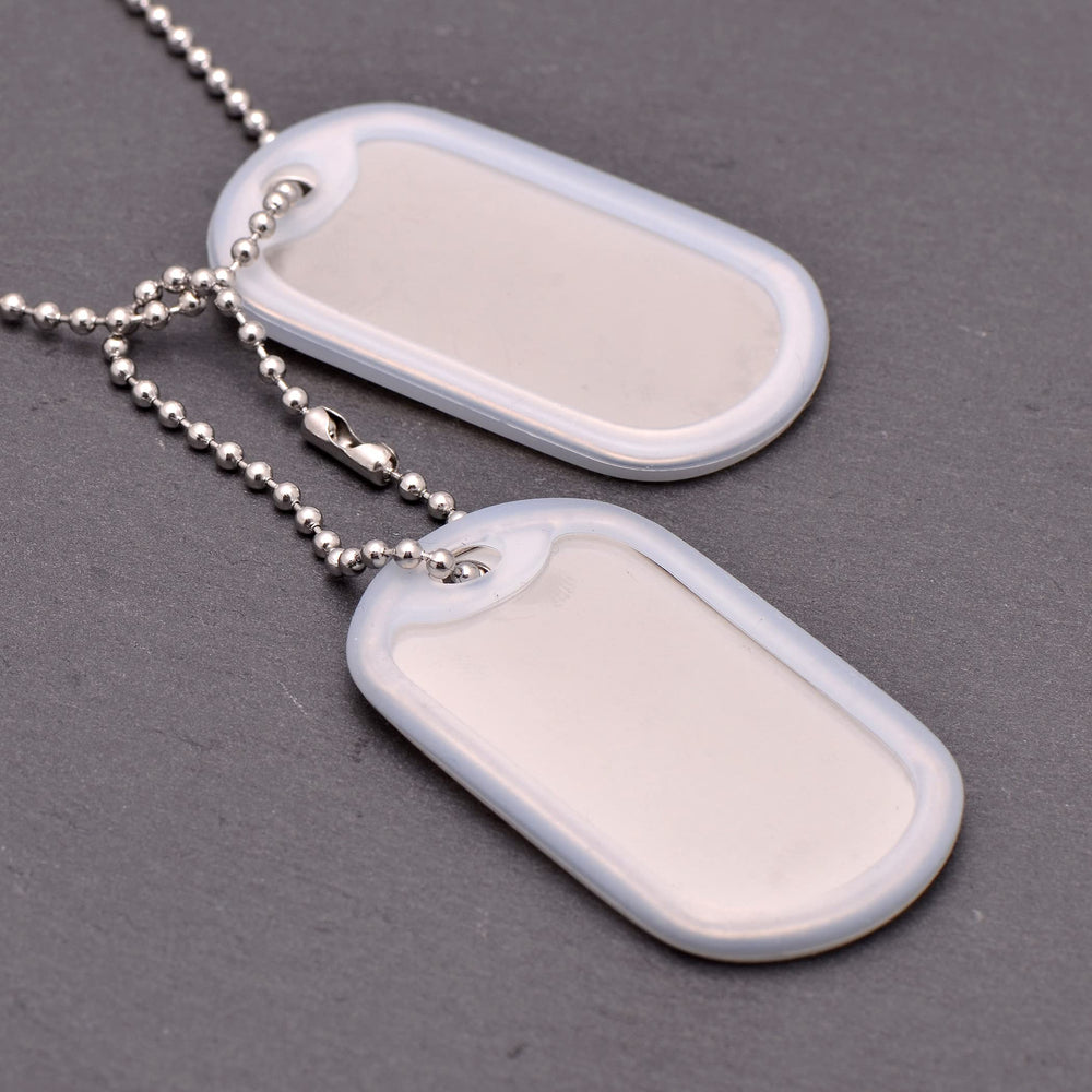 Paialco white rubber silencers on tags reduce jingling during activity.