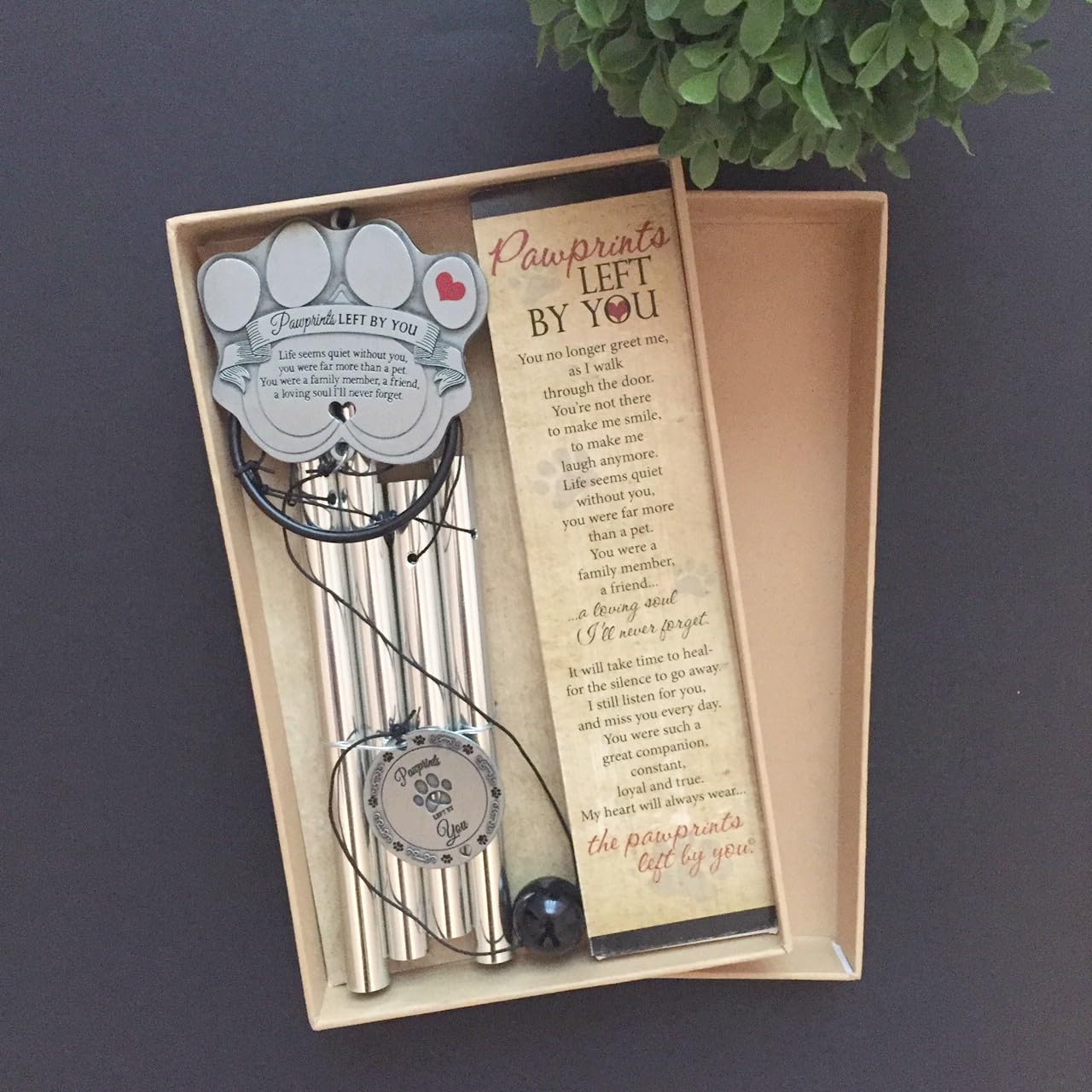 Pawprints Left By You wind chime with four tubes creates a gentle melody.