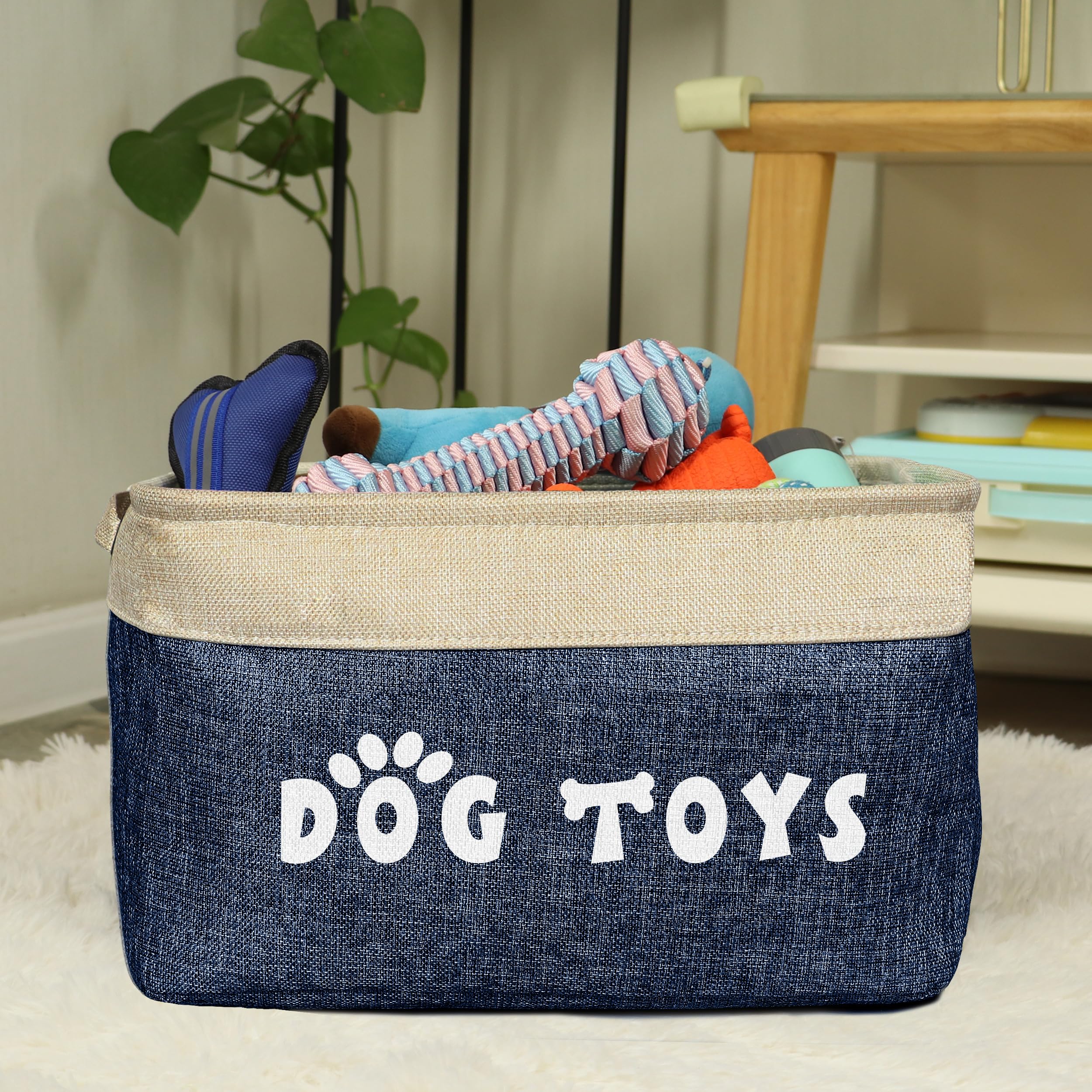 PET ARTIST dog toy basket navy blue full of toys adds organized charm.