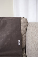 Pet Parents Pain-Free Pet Repeller Mat on couch side view showing deterrent design.
