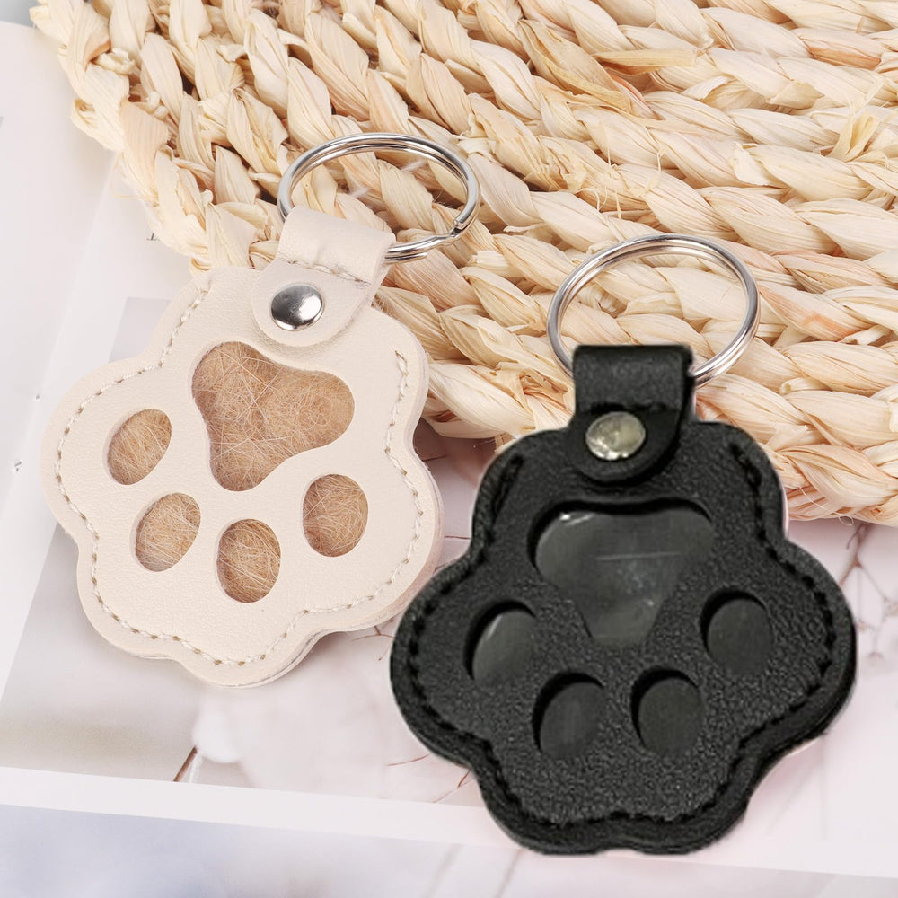 Pet paw leather keychain design featuring durable charm for daily use.