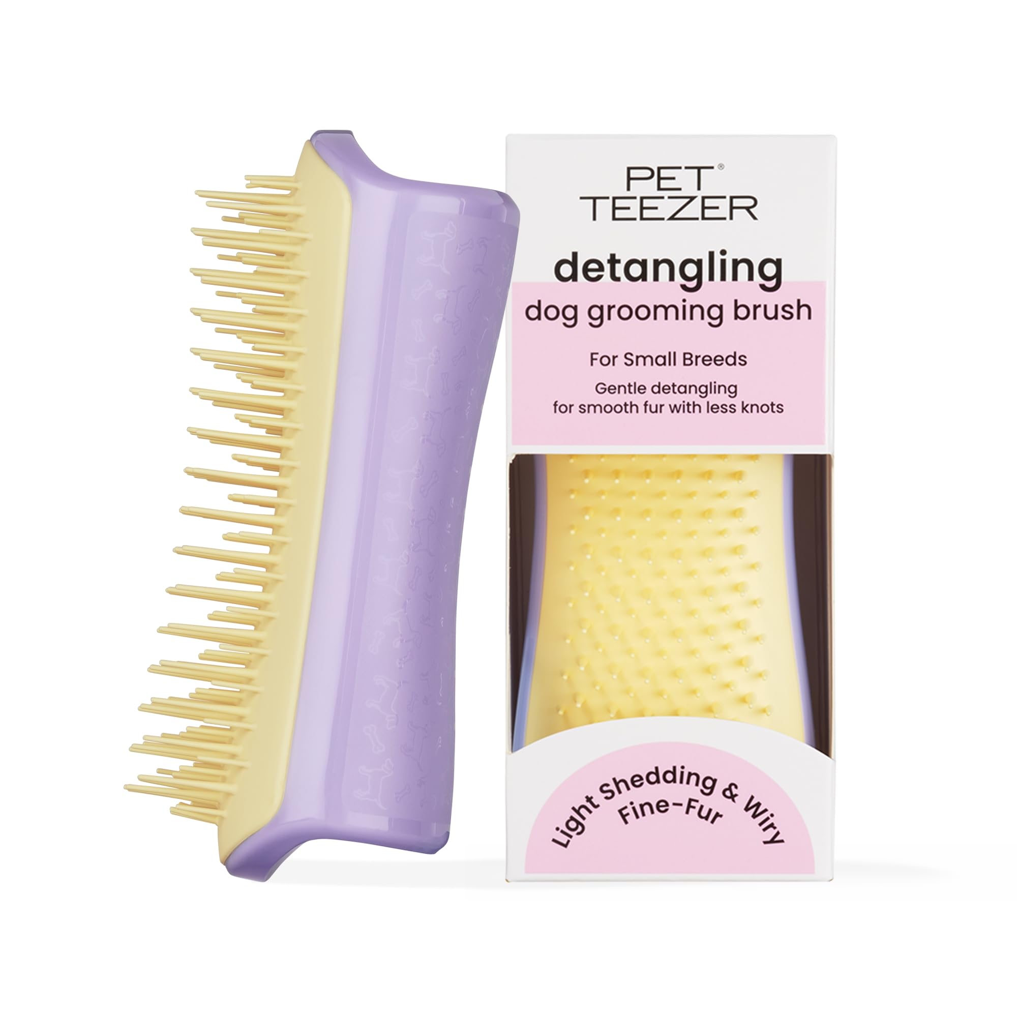 Pet Teezer detangling brush on lilac-yellow coat for gentle detangling and undercoat access.