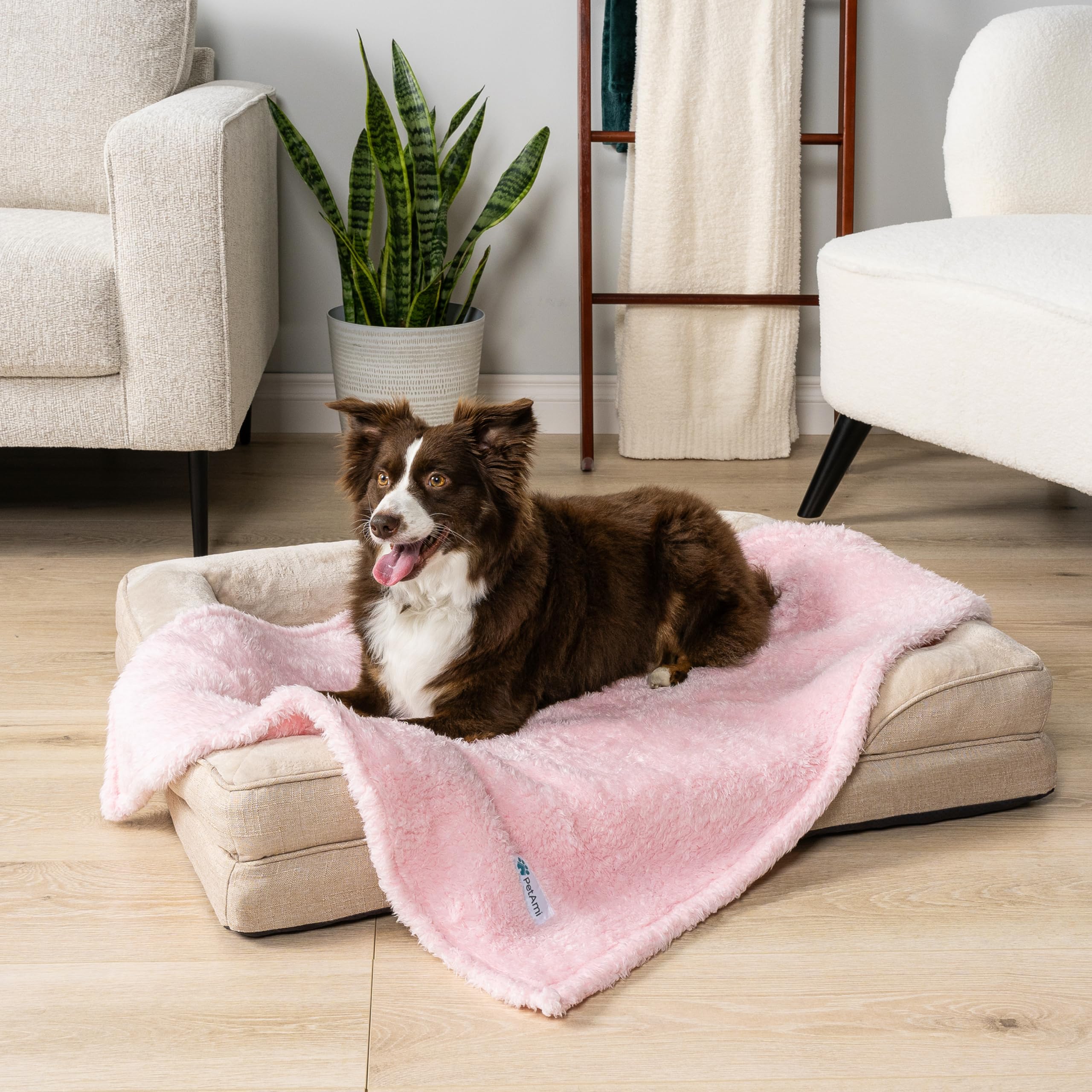 PetAmi pink pet blanket in car seat conveys travel comfort for pets.