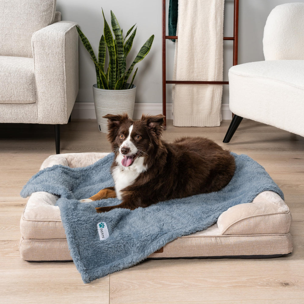 PetAmi reversible pet blanket on bed highlights two looks and extra warmth.