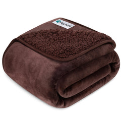 PetAmi waterproof dog blanket on a couch protects furniture from spills.
