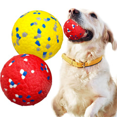 Petcare indestructible dog ball yellow promotes dental gum massage during play.