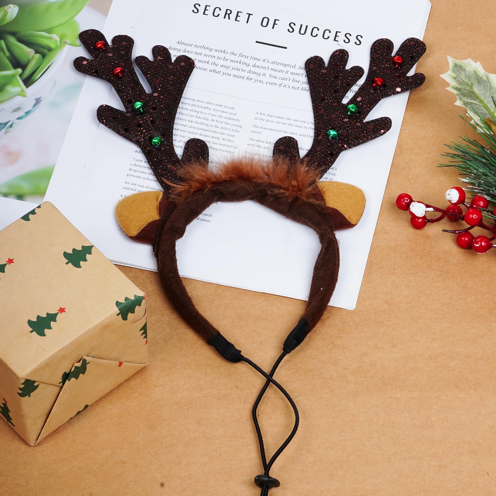 phnydreg dog reindeer antlers headband brown color complements winter outfits.