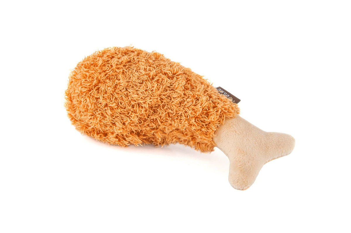 P.L.A.Y. plush fried chicken drumstick (X-Small) encourages playful chewing for small dogs.