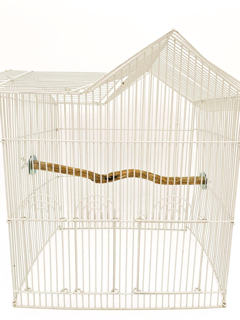 Polly's full-length perch side view in cage — sturdy design for safety.