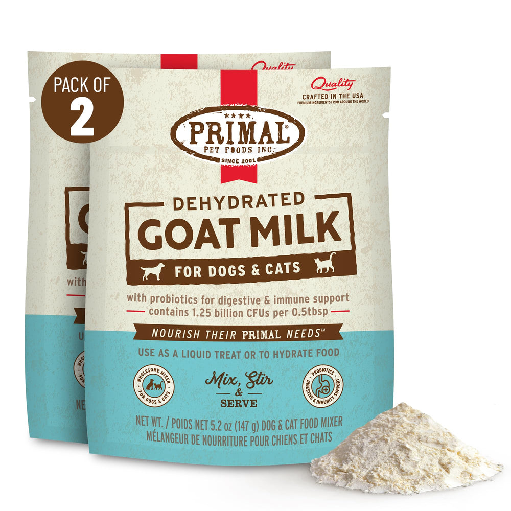 Primal Goat Milk Powder topper being stirred with warm water for hydration support